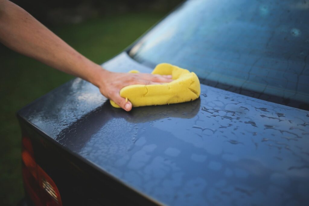 Mobile Detailing: Person Washing a car