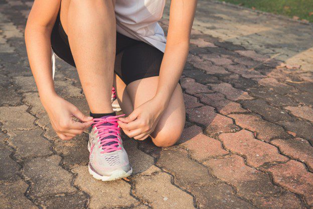 Healthy Leaders- Runner tying shoelace